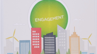 Illustration with skyscrapers, windmills and a yellow-green circle in the background saying Engagementhrift Engagement