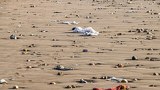 Plastic waste on sandy soil